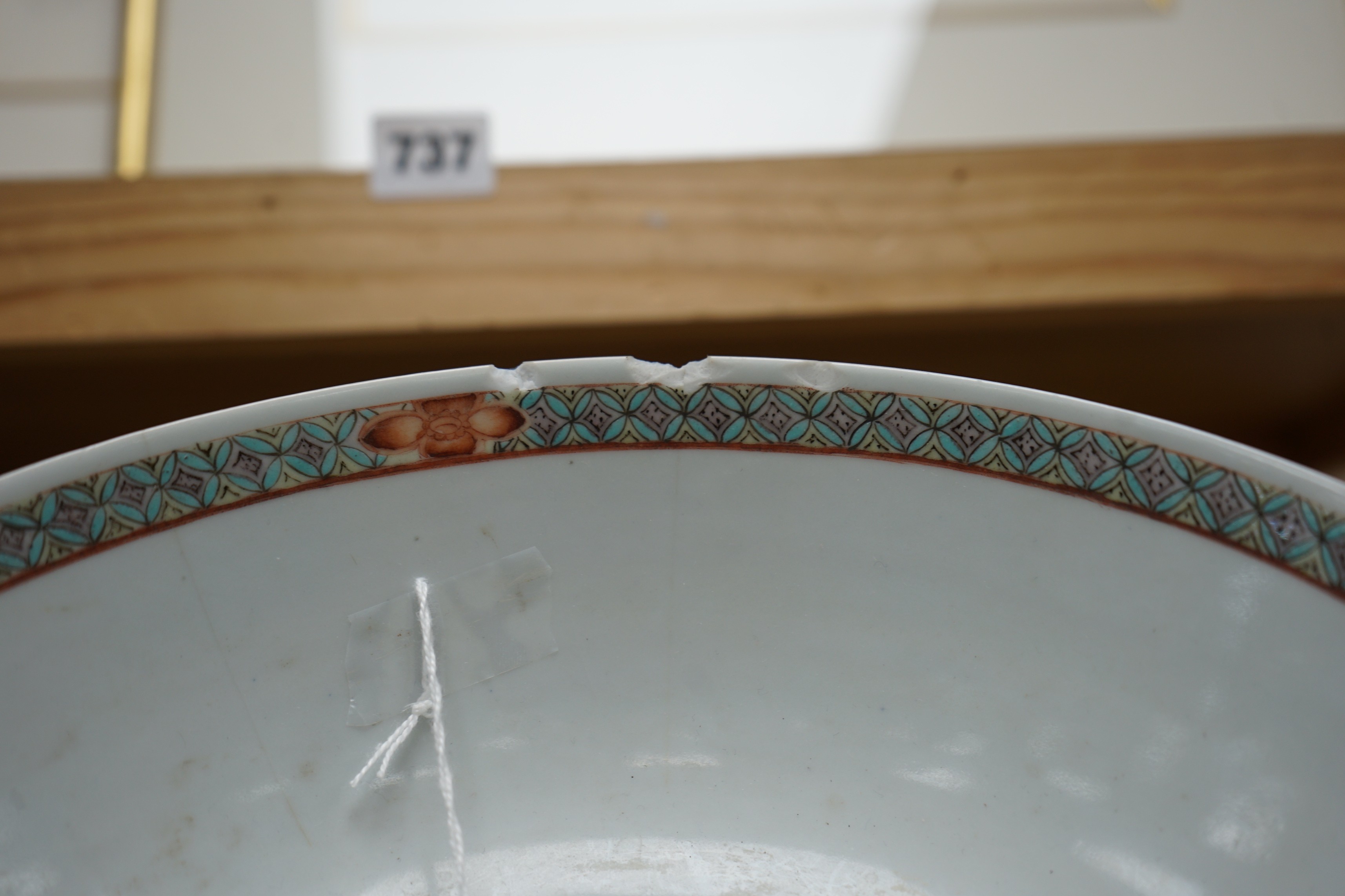 A 19th century Chinese famille verte powder blue bowl, 26cm diameter, wood stand